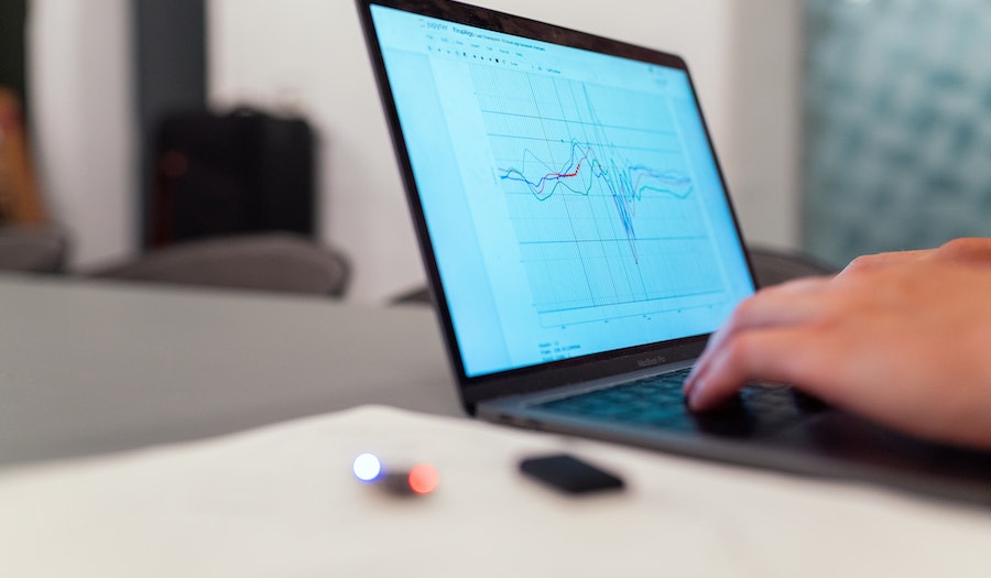 A laptop displaying a graph